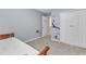 Bedroom features ocean-themed wall decor, and a bed with neutral bedding at 5603 Whisperwood Dr, Durham, NC 27713