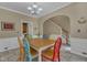 Open dining area featuring tile floors and white wainscoting at 5603 Whisperwood Dr, Durham, NC 27713