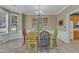 Charming dining area with colorful chairs and light filled windows at 5603 Whisperwood Dr, Durham, NC 27713