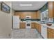 Spacious kitchen featuring a full suite of white appliances and a bright, welcoming atmosphere at 5603 Whisperwood Dr, Durham, NC 27713