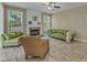 Cozy living room featuring a brick fireplace and comfortable seating at 5603 Whisperwood Dr, Durham, NC 27713