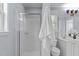 The bathroom features a glass-enclosed shower, dual sink vanity, and a window at 6004 Solitude Way, Durham, NC 27713