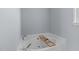 Spacious soaking tub with a wooden tray and a window bringing in natural light at 6004 Solitude Way, Durham, NC 27713