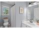 This bathroom has a modern vanity and a shower with a patterned curtain at 6004 Solitude Way, Durham, NC 27713