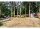 This backyard is surrounded by trees at 6313 Belle Crest Dr, Raleigh, NC 27612