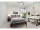 Cozy bedroom featuring a stylish vanity, a large bed, and ample natural light at 6313 Belle Crest Dr, Raleigh, NC 27612