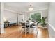 Elegant dining room with natural light and a stylish chandelier at 6313 Belle Crest Dr, Raleigh, NC 27612