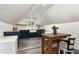 Charming kitchen featuring blue cabinets, stainless appliances, and a wooden dining table at 6313 Belle Crest Dr, Raleigh, NC 27612