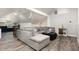 Cozy living room with a large sectional sofa, a projector, and a hardwood floor at 6313 Belle Crest Dr, Raleigh, NC 27612