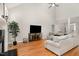 Comfortable living room with hardwood floors, high ceilings and a fireplace at 6313 Belle Crest Dr, Raleigh, NC 27612
