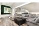 Spacious living room featuring a large sectional sofa, a projector and unique decor at 6313 Belle Crest Dr, Raleigh, NC 27612