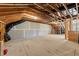 Unfinished attic space with exposed wooden beams and a plywood floor, offering potential for customization at 640 Barneswyck Dr, Fuquay Varina, NC 27526
