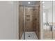 Bathroom showcases a glass enclosed tiled shower with built-in niche and tiled walls at 640 Barneswyck Dr, Fuquay Varina, NC 27526