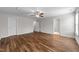 Large bedroom featuring modern wood-look flooring, ceiling fan, and access to an ensuite bathroom at 640 Barneswyck Dr, Fuquay Varina, NC 27526