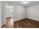Clean bedroom with hardwood floors and a doorway that fills the space with lots of light at 640 Barneswyck Dr, Fuquay Varina, NC 27526