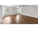 Spacious bedroom with natural light and modern wood-look flooring at 640 Barneswyck Dr, Fuquay Varina, NC 27526