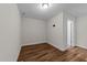 Clean bedroom with hardwood floors and a doorway that fills the space with lots of light at 640 Barneswyck Dr, Fuquay Varina, NC 27526