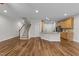 Open-concept kitchen with hardwood floors, granite countertops, and stainless steel appliances at 640 Barneswyck Dr, Fuquay Varina, NC 27526