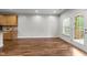 Bright living room featuring hardwood floors, and a door leading to the outside at 640 Barneswyck Dr, Fuquay Varina, NC 27526