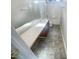 Bright bathroom with vanity and shower-tub combo at 6701 Winding Arch Dr, Durham, NC 27713