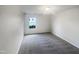 Neutral bedroom featuring a window at 6701 Winding Arch Dr, Durham, NC 27713