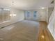 Expansive living room boasting abundant natural light and a versatile space for entertaining guests at 6701 Winding Arch Dr, Durham, NC 27713