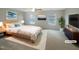Tranquil bedroom with neutral tones, soft carpeting, and bright windows. (Virtually staged) at 6701 Winding Arch Dr, Durham, NC 27713