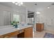 Open bathroom with dual vanities, a window, and a separate shower at 705 Harkness Cir, Durham, NC 27705