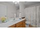 Bright bathroom with a vanity sink, neutral walls, and a decorative shower curtain at 705 Harkness Cir, Durham, NC 27705