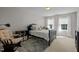 Bedroom with a dark wood frame bed and an accent chair at 705 Harkness Cir, Durham, NC 27705