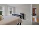 Bedroom with a dark wood frame bed and a black bookshelf at 705 Harkness Cir, Durham, NC 27705