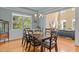 Elegant dining room features stylish chandelier, large window, and seamless access to living area at 705 Harkness Cir, Durham, NC 27705