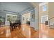 Formal dining room featuring hardwood floors, large window, and easy flow to the living spaces at 705 Harkness Cir, Durham, NC 27705