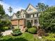Charming two-story home features stone accents, a two-car garage, and landscaped front yard at 705 Harkness Cir, Durham, NC 27705