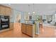 Open kitchen design with wood cabinets and granite countertops provides ample workspace at 705 Harkness Cir, Durham, NC 27705
