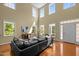 Spacious living room featuring high ceilings, hardwood floors and plenty of natural light at 705 Harkness Cir, Durham, NC 27705