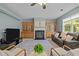 Cozy living room with fireplace, built-in shelving, and comfortable seating at 705 Harkness Cir, Durham, NC 27705