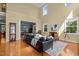 Open-concept living room showcasing hardwood floors, high ceilings and seamless flow at 705 Harkness Cir, Durham, NC 27705