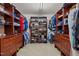 Well-organized walk-in closet with clothing racks and shoe storage at 705 Harkness Cir, Durham, NC 27705