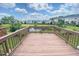Wide view from a deck overlooking a pond and neighborhood houses at 732 Suffield Way, Cary, NC 27519