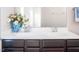 Bathroom vanity with double sinks, white countertop, and dark wood cabinets at 732 Suffield Way, Cary, NC 27519