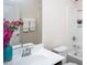 Bright bathroom features a white vanity with floral decorations and a shower/tub combo at 732 Suffield Way, Cary, NC 27519