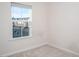 Bright bedroom features a large window with neighborhood views and neutral carpet at 732 Suffield Way, Cary, NC 27519