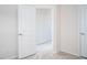Bedroom with open closet with view to a bright hallway at 732 Suffield Way, Cary, NC 27519
