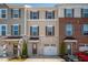 Charming townhome featuring a one-car garage and unique architectural details at 732 Suffield Way, Cary, NC 27519