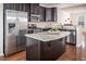 Stylish kitchen island with granite countertops and stainless steel appliances at 732 Suffield Way, Cary, NC 27519