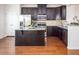 Well-appointed kitchen featuring a central island and ample cabinet space at 732 Suffield Way, Cary, NC 27519