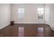 Bright living room featuring hardwood floors and large windows at 732 Suffield Way, Cary, NC 27519