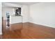 Open-concept living room with hardwood floors and plenty of natural light at 732 Suffield Way, Cary, NC 27519