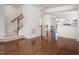 Spacious living room showcasing hardwood floors and a staircase at 732 Suffield Way, Cary, NC 27519
